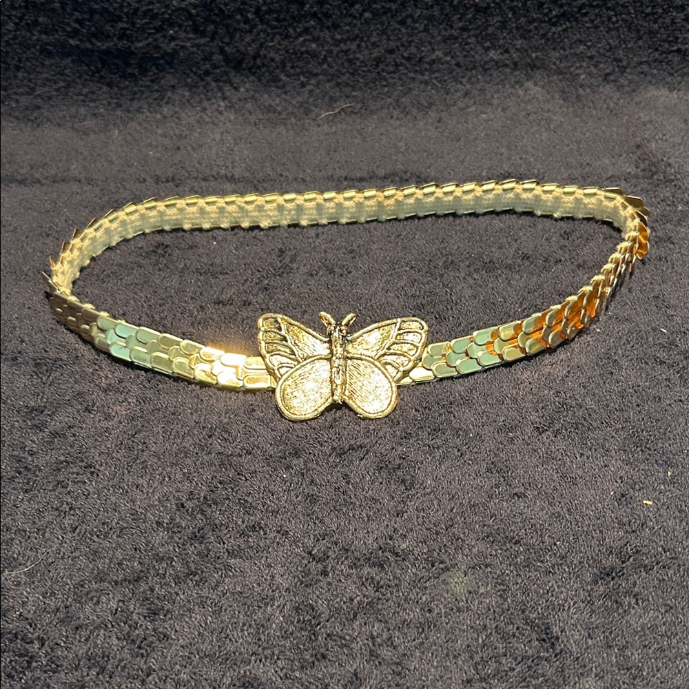 Belt with Butterfly Buckle. Elastic stretch belt, 21 to 36 inches.